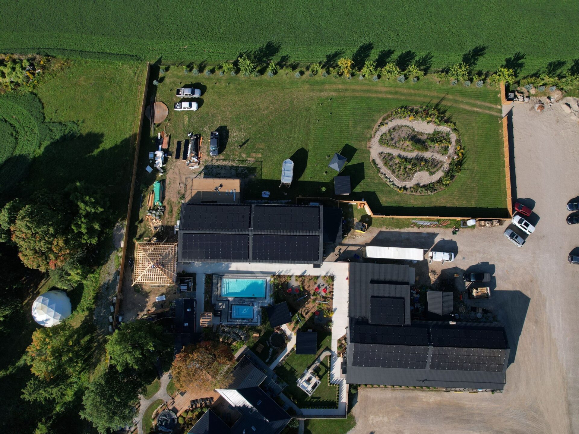 Aerial view of Terra Nova Spa & Cafe's two buildings with commercial solar PV systems.